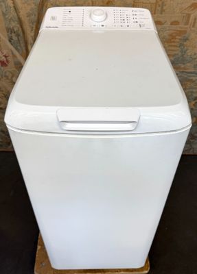 an image of a white washer and dryer in a living room