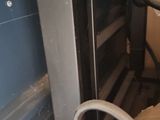 a box of boxes and a pair of scissors in the corner of a room