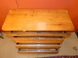 a wooden table with six drawers on top of it