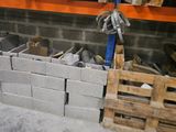 a pile of bricks sitting on a shelf in a room