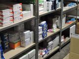 boxes and boxes are stacked on the shelves in a warehouse