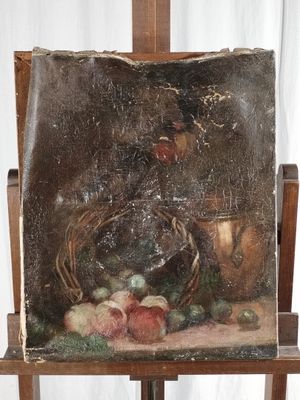 a picture of a painting on an easel with a painting of fruit on it
