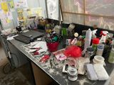 a desk with a lot of clutter on it