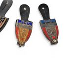 three different types of badges are displayed on a white surface