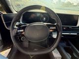 the interior of a car with a steering wheel and dashboard controls