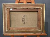 an old wooden easel with a painting on top of it