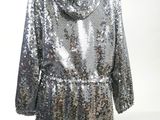 a silver sequinized jacket on a mannequin mannequin