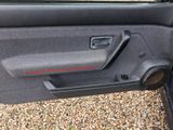 the door panel of a car with a red stripe on it