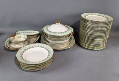 a lot of plates and cups that are sitting on a table