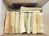 a box full of old books sitting on a table