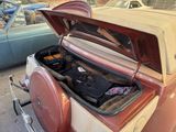 a trunk of an old car with a grill in it