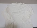 the sweater is white and has long sleeves on it