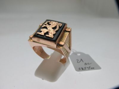 une image représentant une bague ornée d'un lion