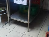 a picture of a kitchen with a table and chairs