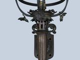 an image of a lamp post with a bird on it