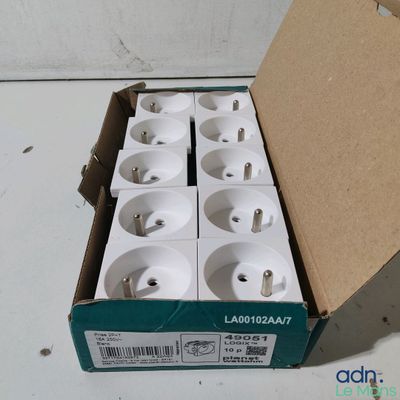 a box of white electrical plugs sitting on a table