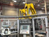 a machine that is working on a piece of machinery
