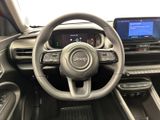 the interior of a car with a steering wheel, dashboard, and dashboard controls