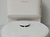 a white robot that is sitting on a table