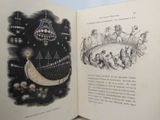 an open book with a picture of a man and a woman in a boat