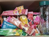 a box of snacks and a water bottle in it