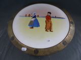 a plate with a picture of a man and a woman on it