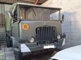 a military truck that is parked in a garage