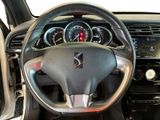 the interior of a car with a steering wheel and dashboard controls