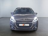the front view of a grey car in a white room