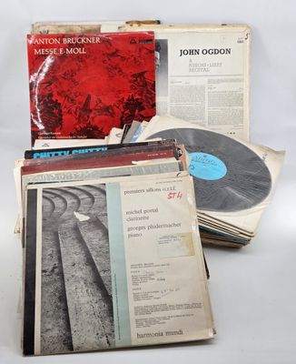 an assortment of records including a record, a record case and a record