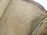 a close up of a bag with a tag on it