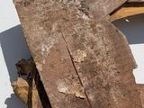 a piece of wood sitting on top of a piece of wood