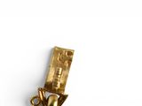 a gold charm with a heart on it on a white surface