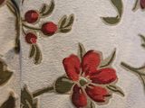 an image of a close up of a red and green floral fabric