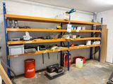 a garage with a lot of shelves and tools on it