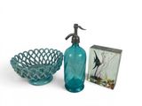 blue glass soap dispenser, bowl and soap dispenser on a white background
