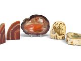 several different types of stones are arranged on a white surface