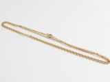 a gold necklace with a chain that is attached to it