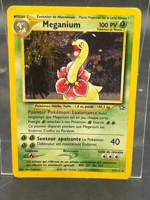 the pokemon card is in a clear plastic case
