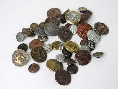 a pile of coins on a white surface with a white background