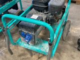 a small green cart with two small engines on it
