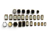 a lot of watches that are sitting on a white surface