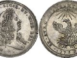 a silver coin with a bird on the front and a bird on the back