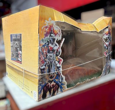 a cardboard box with a picture of a man riding a horse