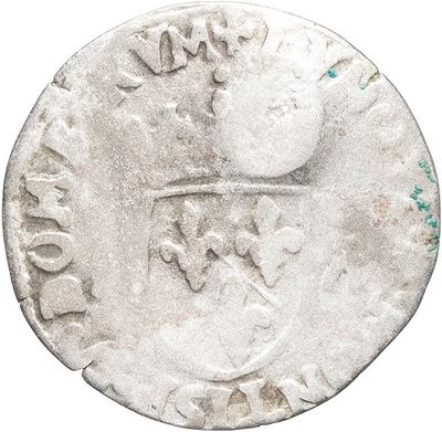 a close up of a coin with a bird on it