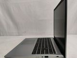 an open laptop computer sitting on top of a white surface