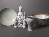 two bowls and a bowl sitting next to each other on a table