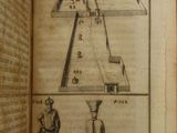 someone is holding a book with a drawing of a pyramid in the middle of it