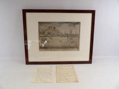framed picture of a couple of old papers sitting on a table