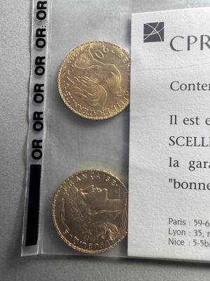 a small piece of paper with a picture of a gold coin on it